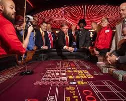 agenbeting platform dashboard showing football matches, live casino tables, and slot games across mobile and desktop
