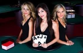Live blackjack dealer at agenbeting studio with HD camera and chat interface